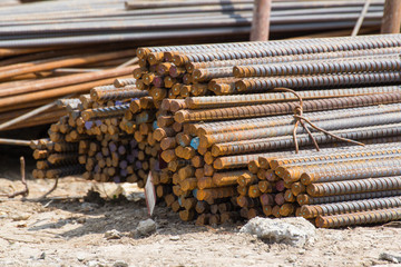 rust steel bars on ground in construction site