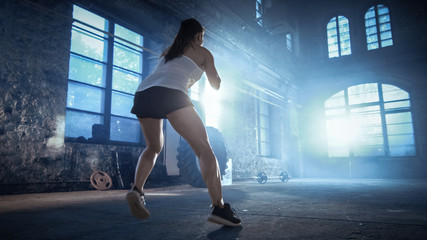 Fit Athletic Woman Does Footwork Running Drill in a Deserted Factory Remodeled into Gym. Cross...
