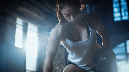 Strong Athletic Woman Does Dumbbell Bench Press Exercise as Part of Her Cross Fitness Bodybuilding...
