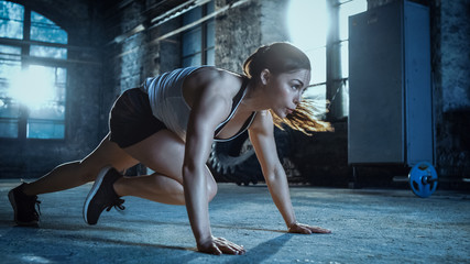 Athletic Beautiful Woman Does Running Plank as Part of Her Cross Fitness, Bodybuilding Gym Training Routine. - obrazy, fototapety, plakaty