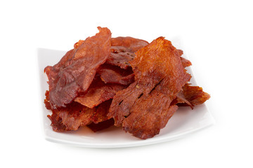 Sweet pork sheet - asian food style in white plate isolated on a white background.