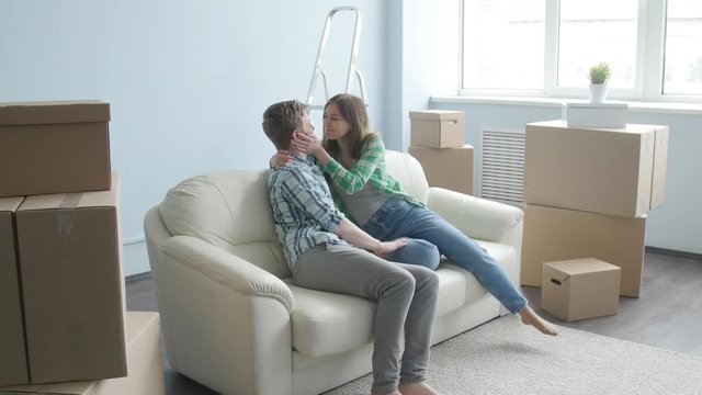 Young happy couple in a new apartment. The concept of buying or rent a new property
