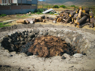 Oven with the agave pine aka pinas at the process of tequila production, Oaxaca, Mexico - 206695466