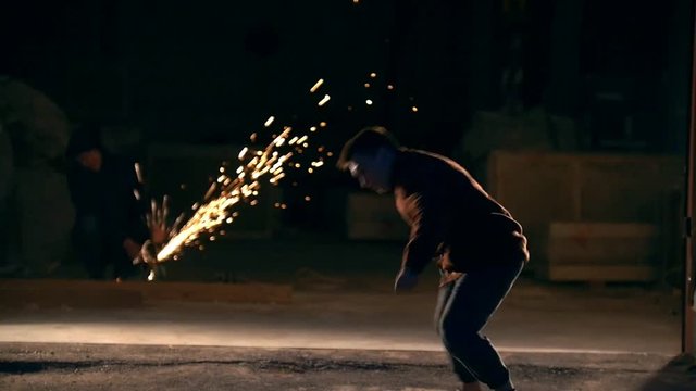 Tricks of martial arts, feilong, night against the background sparks, slow-motion