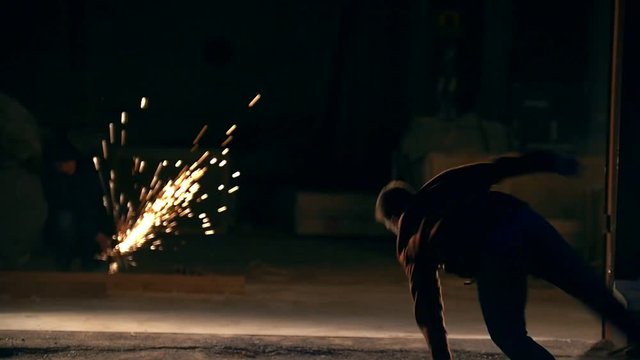 Raize, tricks of martial arts, night city against the background sparks, slow-motion