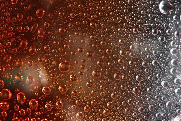 liquid droplets on a transparent surface