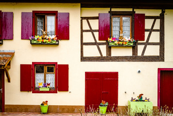 Old classic windows in historical village in Alsace