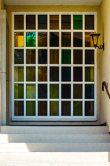 Beautiful old windows with colorful glasses, leaded-pane