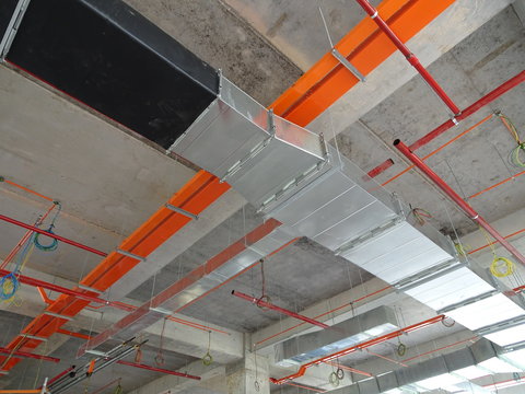 Electrical conduit, cable tray and aircond pipes as part of services above ceiling installed at the construction. 