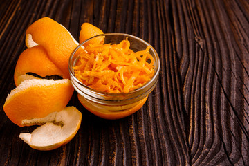 oranges and juice on a wooden background