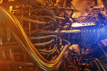 Gas turbine engine of feed gas compressor located inside pressurized enclosure, The gas turbine engine used in offshore oil and gas central processing platform.