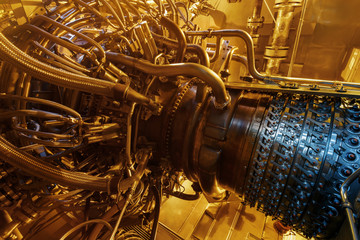 Gas turbine engine of feed gas compressor located inside pressurized enclosure, The gas turbine engine used in offshore oil and gas central processing platform.