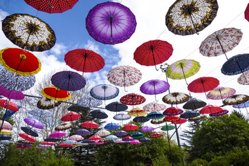 The colors in the sky are umbrellas in dozens of different patterns,
