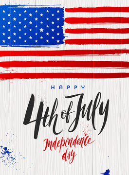 4th of July, Independence day - Brush calligraphy greeting and USA flag on a wooden plank background. Vector illustration.
