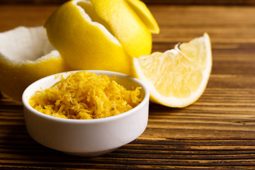 Lemon and juice on a wooden background