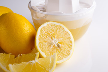 Lemon and juice on a white background