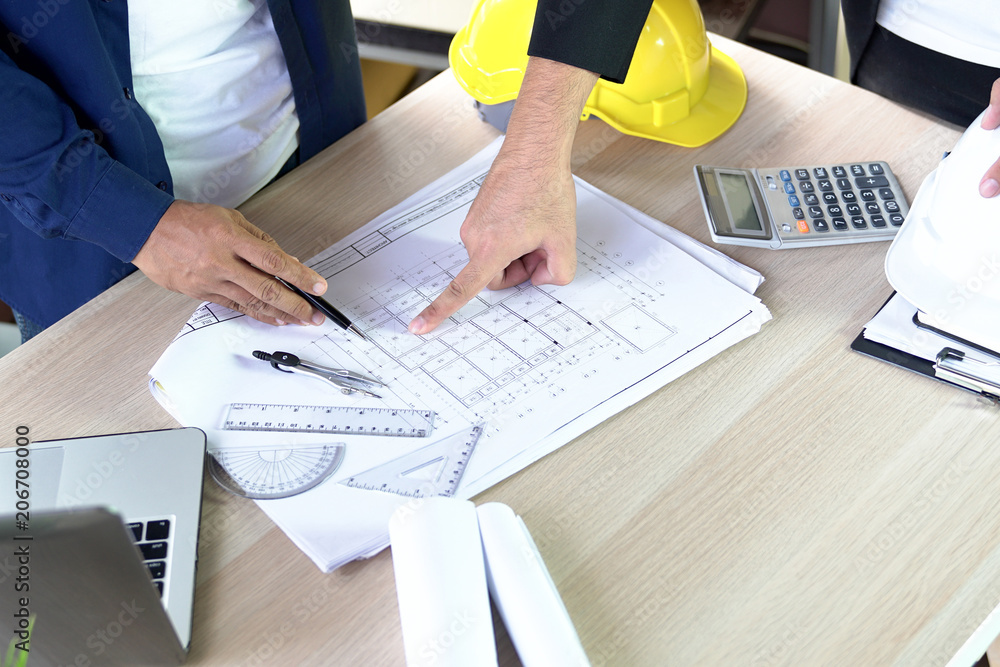 Poster flat lay of top view desk work table architect with drawing home plan building and stationary in hom