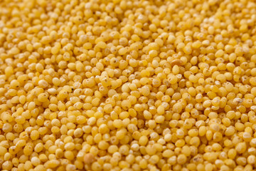 bowl of millet on a white wooden background
