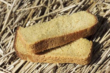 Two pieces of black bread. The bread lies on the grown bread. The depth of focus is very small