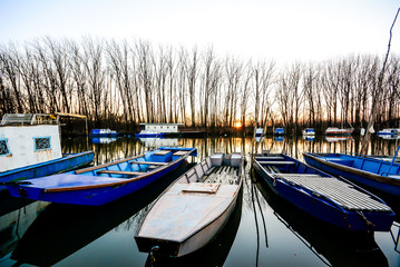 sunset on the river with old boats.