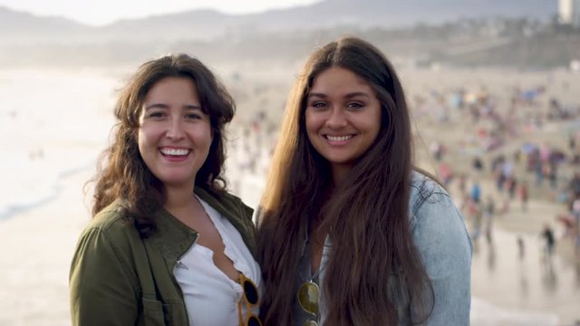 Happy Young Women Smile For Portrait At Sunset, Santa Monica Beach In Background (Shot On Red Scarlet-W Dragon In 4K, Slow Motion)