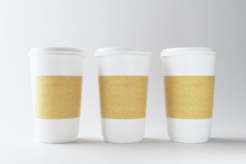 Blank three white coffee cups