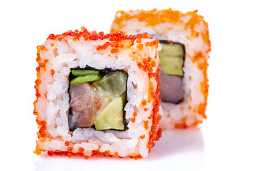 Traditional fresh japanese sushi rolls on a white background, close-up, selective focus.