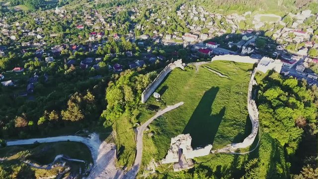 Wonderful romantic summer evening sityscape old town in backlit sunset sunbeam panorama old. Aerial view from the Bona mountain. Kremenets, Ternopil region, Ukraine - aerial view