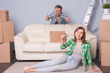 Family with boxes and holding flat keys.