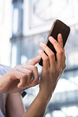 Smart phone in female hand.