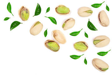 Pistachios with leaves isolated on white background with copy space for your text, top view. Flat lay pattern