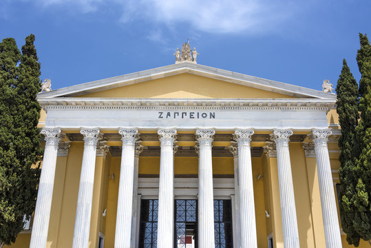 Greece, Athens: Front view of famous Zappeion building in the city center of the Greek capital and part of National Gardens with blue sky in the background - concept architecture travel history