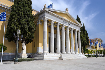 Obraz premium Greece, Athens: Front view of famous Zappeion building in the city center of the Greek capital and part of National Gardens with blue sky in the background - concept architecture travel history
