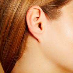 Woman's ear close up, anatomy concept