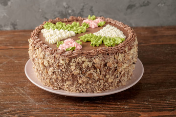 Homemade Kiev cake on old wooden table. The known ukrainian bakery products . Close-up view.