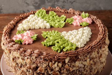 Decorated top of homemade Kiev cake. The known ukrainian bakery products . Close-up view.