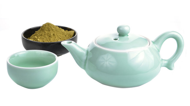 green tea in a green tea pot on whit background