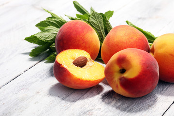 Naklejka na ściany i meble A group of ripe peaches on table