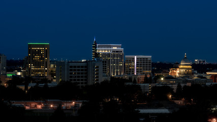 Skyline of Boise Idaho seen at night with deep dark blue sky