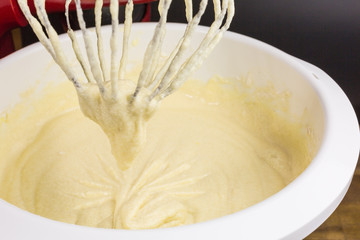 cake batter of butter, eggs, sugar, milk and flour in  a mixing bowl