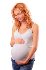 Pregnant woman holding her hands on her belly isolated on white with clipping path.