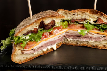 Bacon lettuce and other club sandwich ingredients can be seen