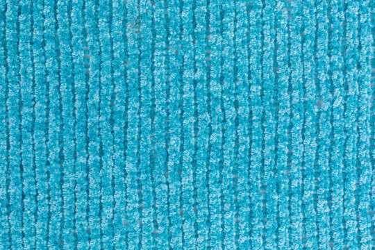 background of knitted chenille yarn in turquoise