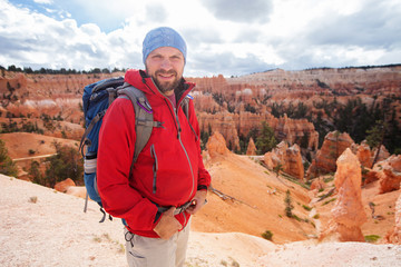 Hiker visits Bryce canyon National park in Utah, USA - obrazy, fototapety, plakaty
