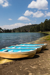 Summer lake landscape with three boats