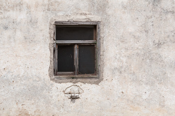 Old wooden window on a house. Exterior house details.
