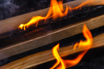 Glowing hot charcoal briquettes close-up background texture. bonfire