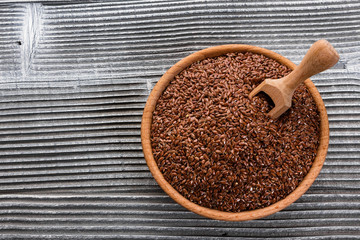 flaxseed and oil on a rustic background