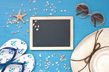 Beach items with   sunglasses  on wooden background