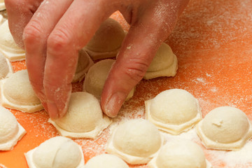 Chef hand Cooking making ravioli, Italian cuisine